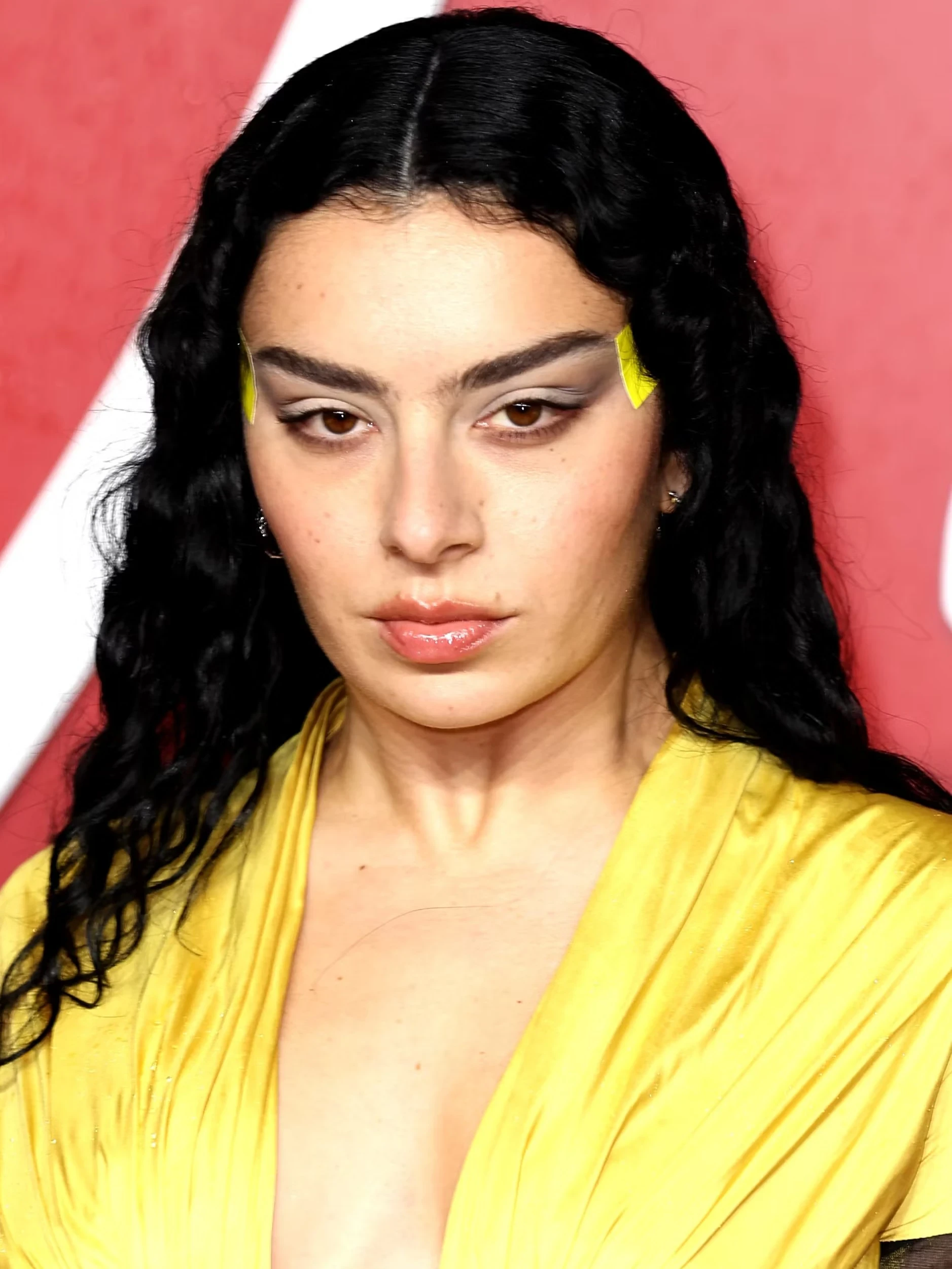 Editorial gallery of Charli XCX styled in bright winter looks with electric blues, magenta accents, and polished black, highlighting electric cobalt, icy magenta, optic white, chrome silver, and inky black.