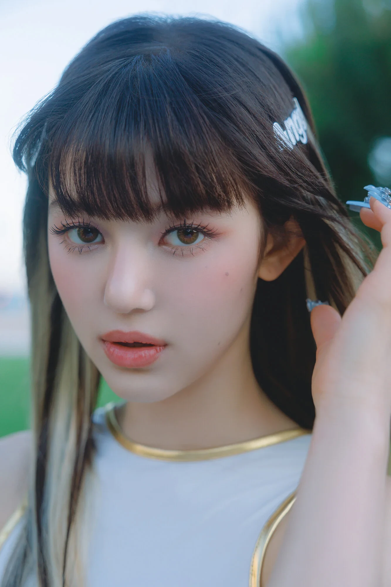 Editorial gallery of Danielle (NewJeans) styled in neutral winter outfits highlighting sapphire, burgundy, and smoked grays, highlighting steel blue, cranberry, optic white, graphite, and imperial purple.