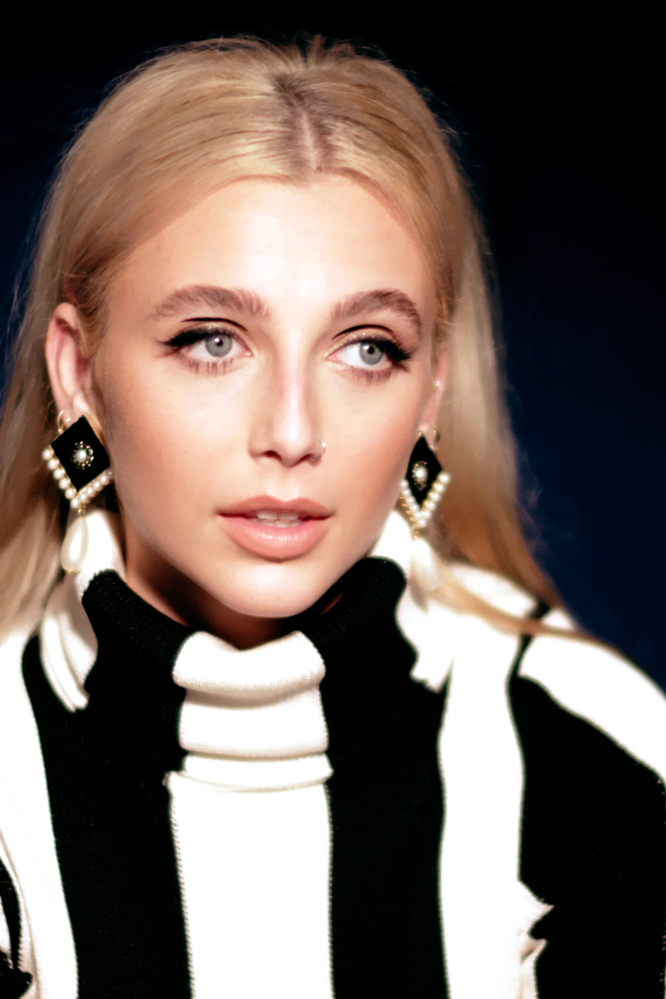 Emma Chamberlain wearing grounded autumn looks with rich neutrals and subtle shimmer, showcasing cappuccino, olive, rust, cream, and denim blue from the Neutral Autumn palette.