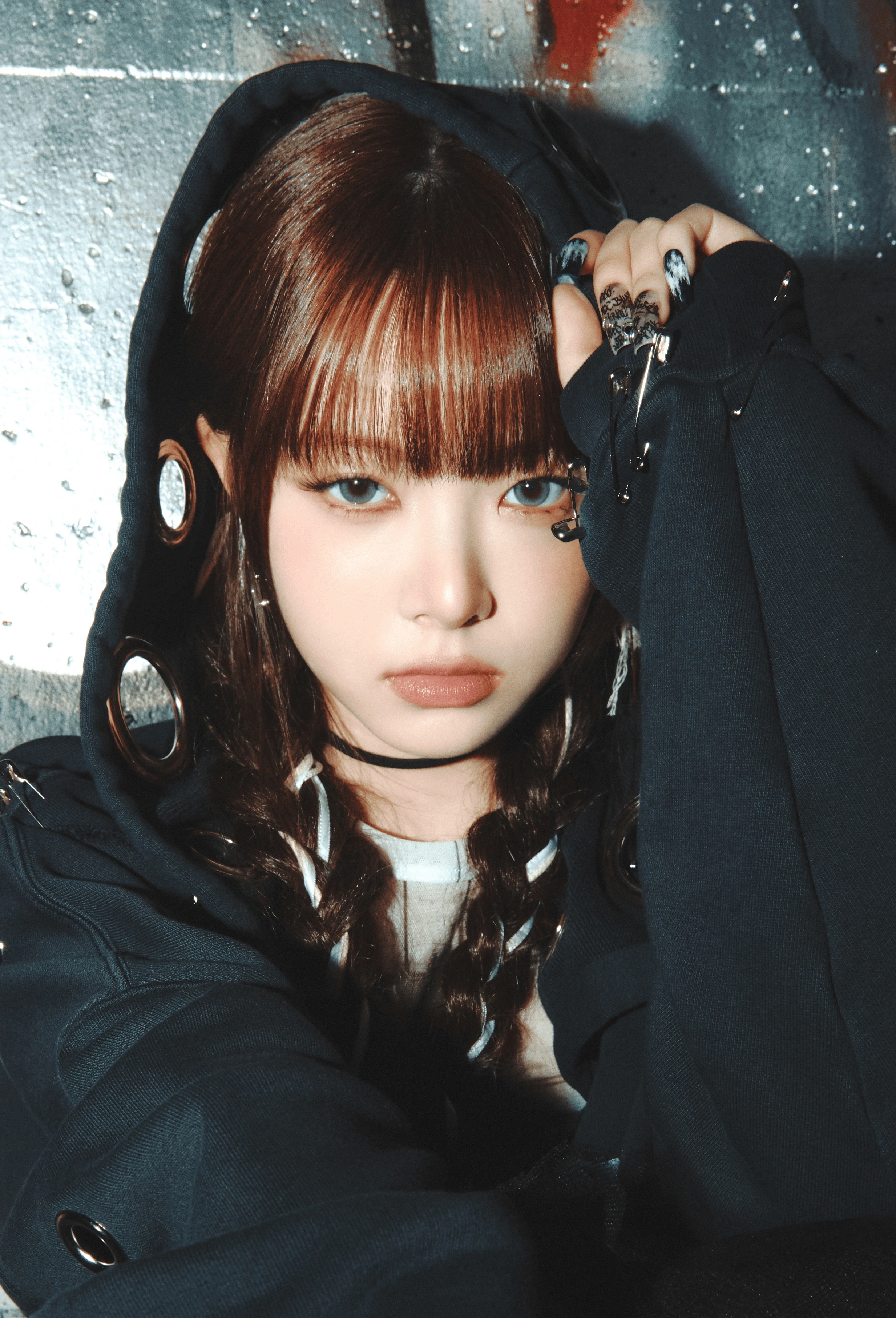 Eunchae (LE SSERAFIM) wearing jewel-toned statement dressing with crisp contrast and sparkle, showcasing electric cobalt, icy magenta, optic white, chrome silver, and inky black from the Bright Winter palette.