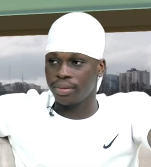 Editorial gallery of Fireboy DML styled in warm autumn wardrobes featuring amber, moss, and bronze metals, highlighting amber, rust, olive, bronze, and cream.