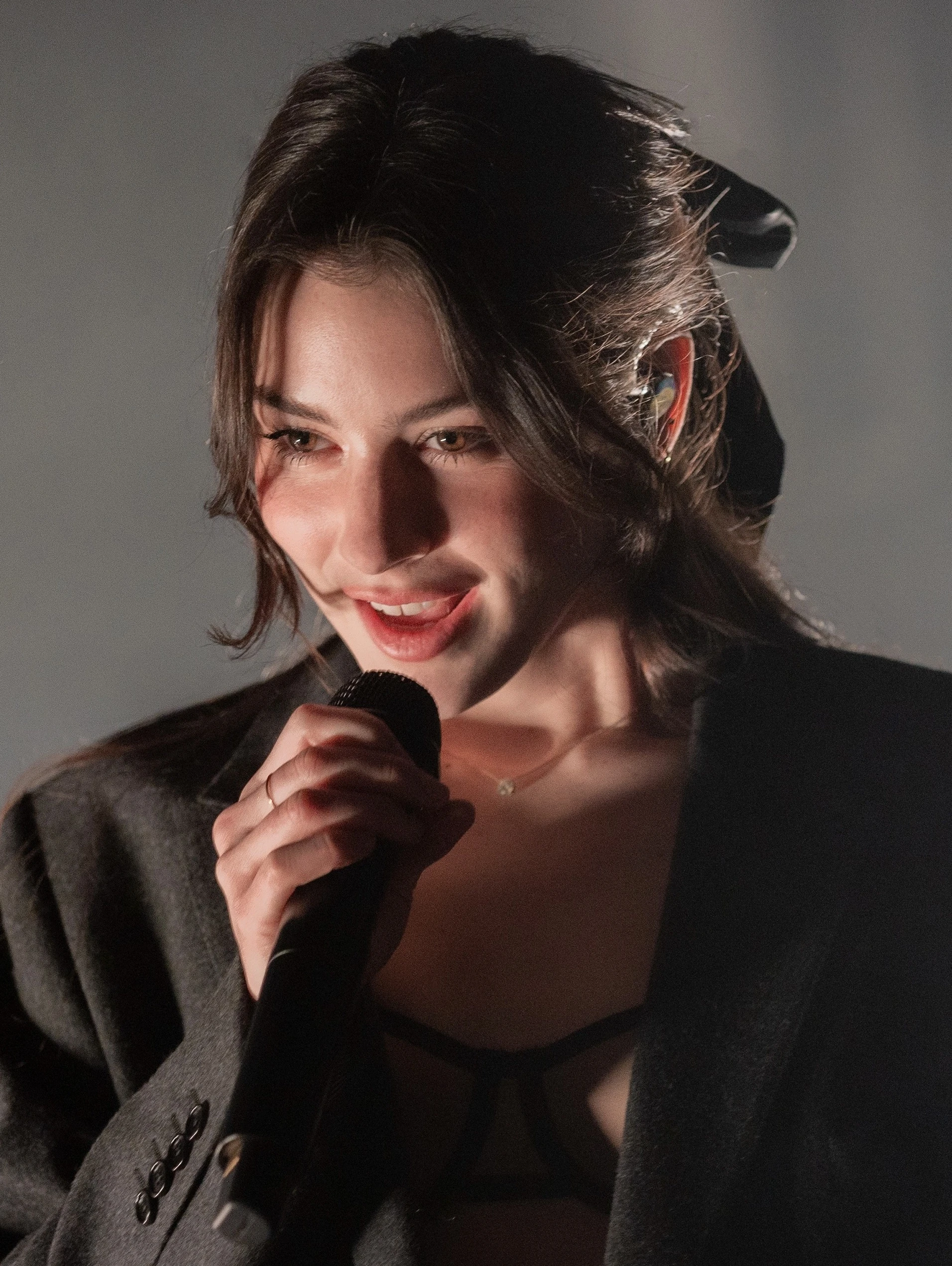 Editorial gallery of Gracie Abrams styled in true summer outfits mixing navy, raspberry, and soft lavender, highlighting powder blue, soft lilac, rose quartz, silvery sage, and midnight plum.