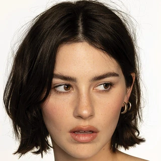 Gracie Abrams wearing cool-toned looks with berry accents and fluid movement, showcasing powder blue, soft lilac, rose quartz, silvery sage, and midnight plum from the True Summer palette.