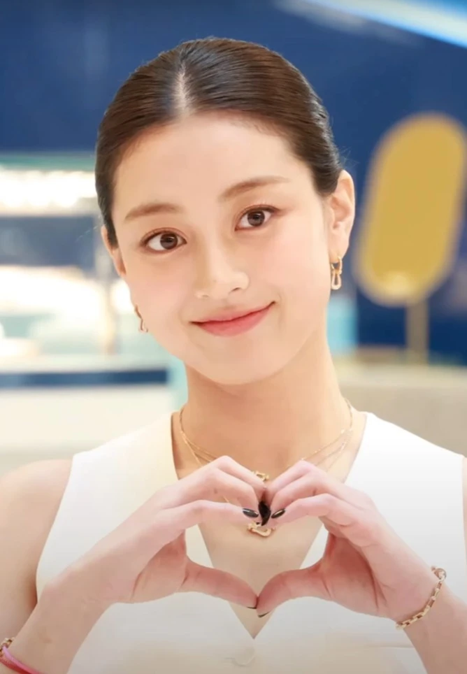 Jihyo (TWICE) wearing jewel-toned statement dressing with crisp contrast and sparkle, showcasing electric cobalt, icy magenta, optic white, chrome silver, and inky black from the Bright Winter palette.