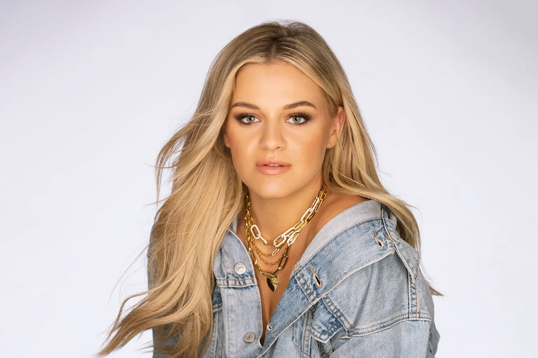 Editorial gallery of Kelsea Ballerini styled in soft summer outfits blending dusty mauve, mist blue, and slate neutrals, highlighting heather gray, dusty mauve, mist blue, slate green, and antique silver.