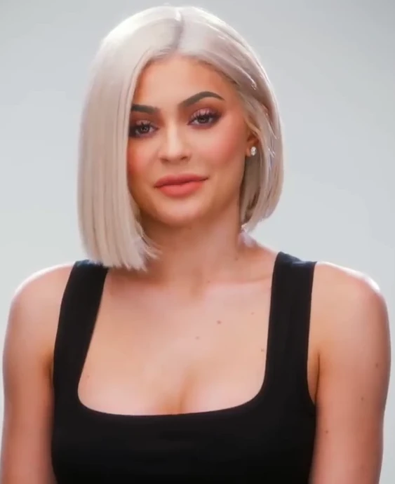 Kylie Jenner wearing balanced jewel-toned looks with cool neutrals, showcasing onyx, graphite, powder pink, optic white, and silver chrome from the Neutral Winter palette.