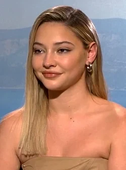 Madelyn Cline wearing sunshine pastel outfits with fluid fabric and glow, showcasing sea glass, sorbet orange, buttermilk, poppy red, and turquoise from the Light Spring palette.