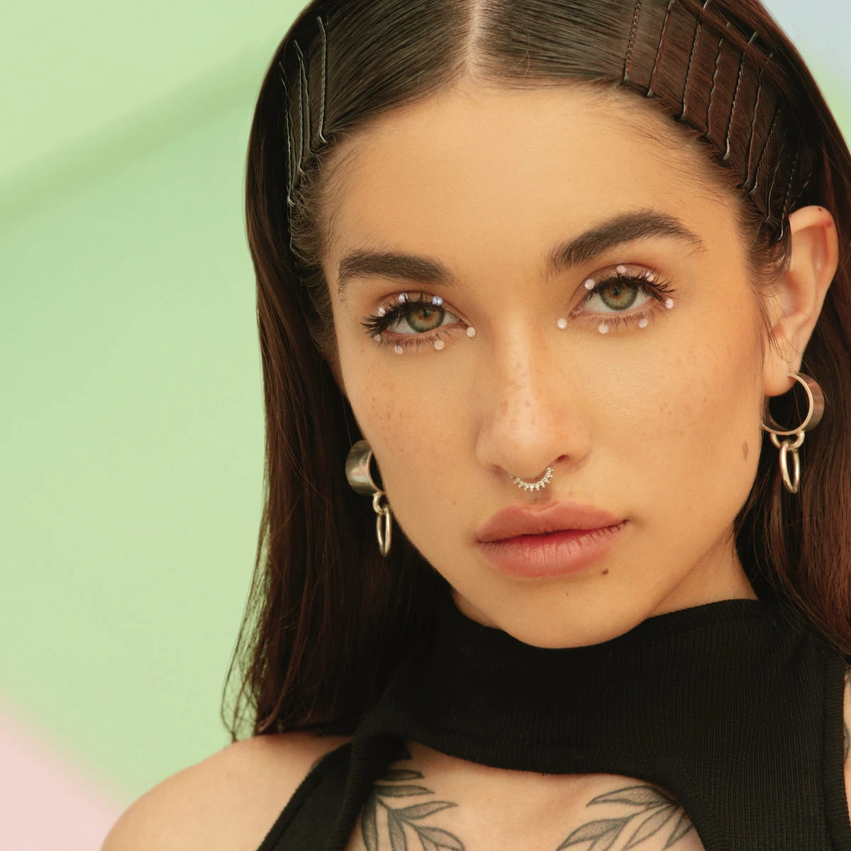 Editorial gallery of Maria Becerra styled in bright winter looks with electric blues, magenta accents, and polished black, highlighting electric cobalt, icy magenta, optic white, chrome silver, and inky black.