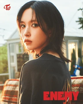 Mina (TWICE) wearing high-voltage winter ensembles with electric hues and chrome accents, showcasing fuchsia, royal blue, silver chrome, acid lime, and deep plum from the Vibrant Winter palette.