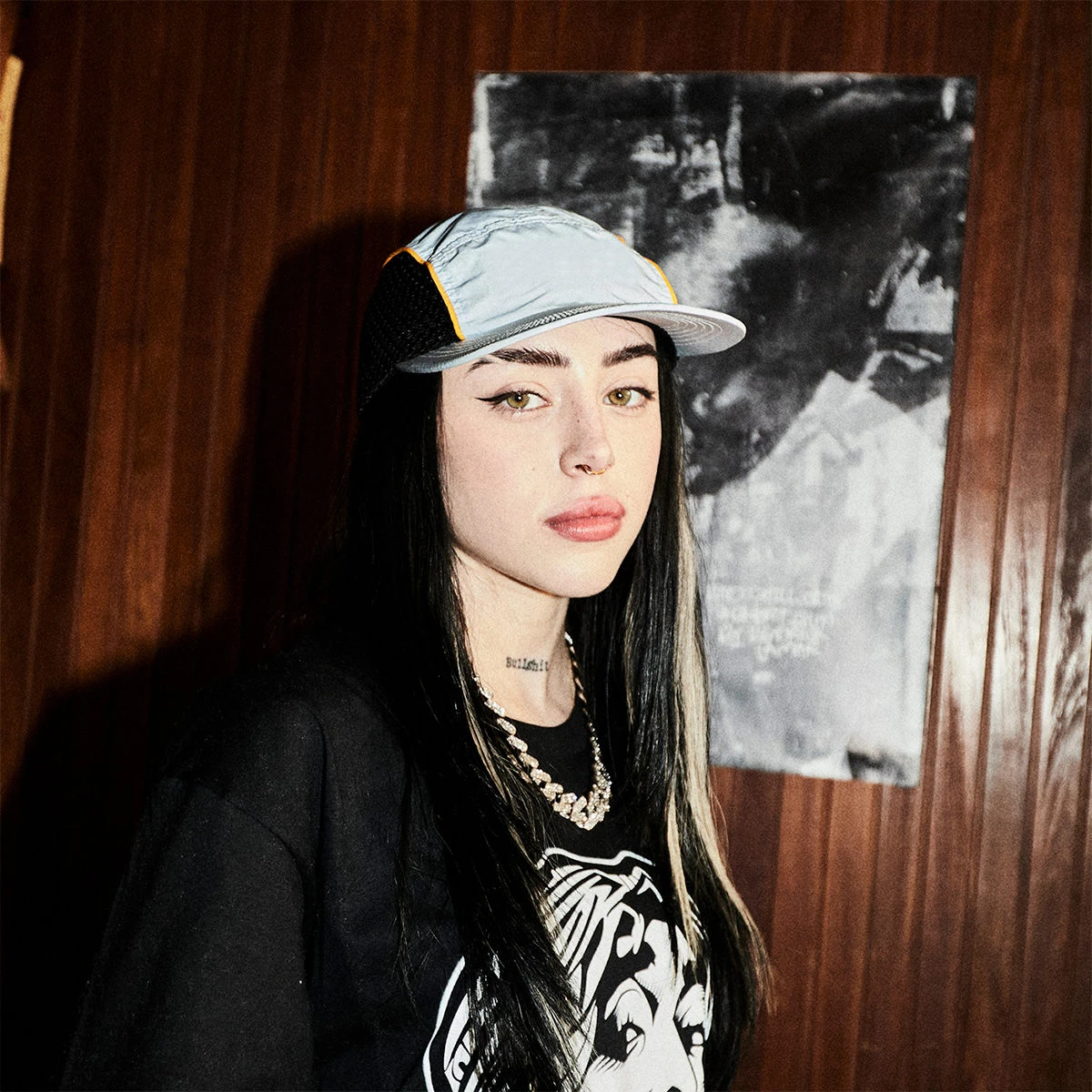 Editorial gallery of Nicki Nicole styled in bright winter looks with electric blues, magenta accents, and polished black, highlighting electric cobalt, icy magenta, optic white, chrome silver, and inky black.