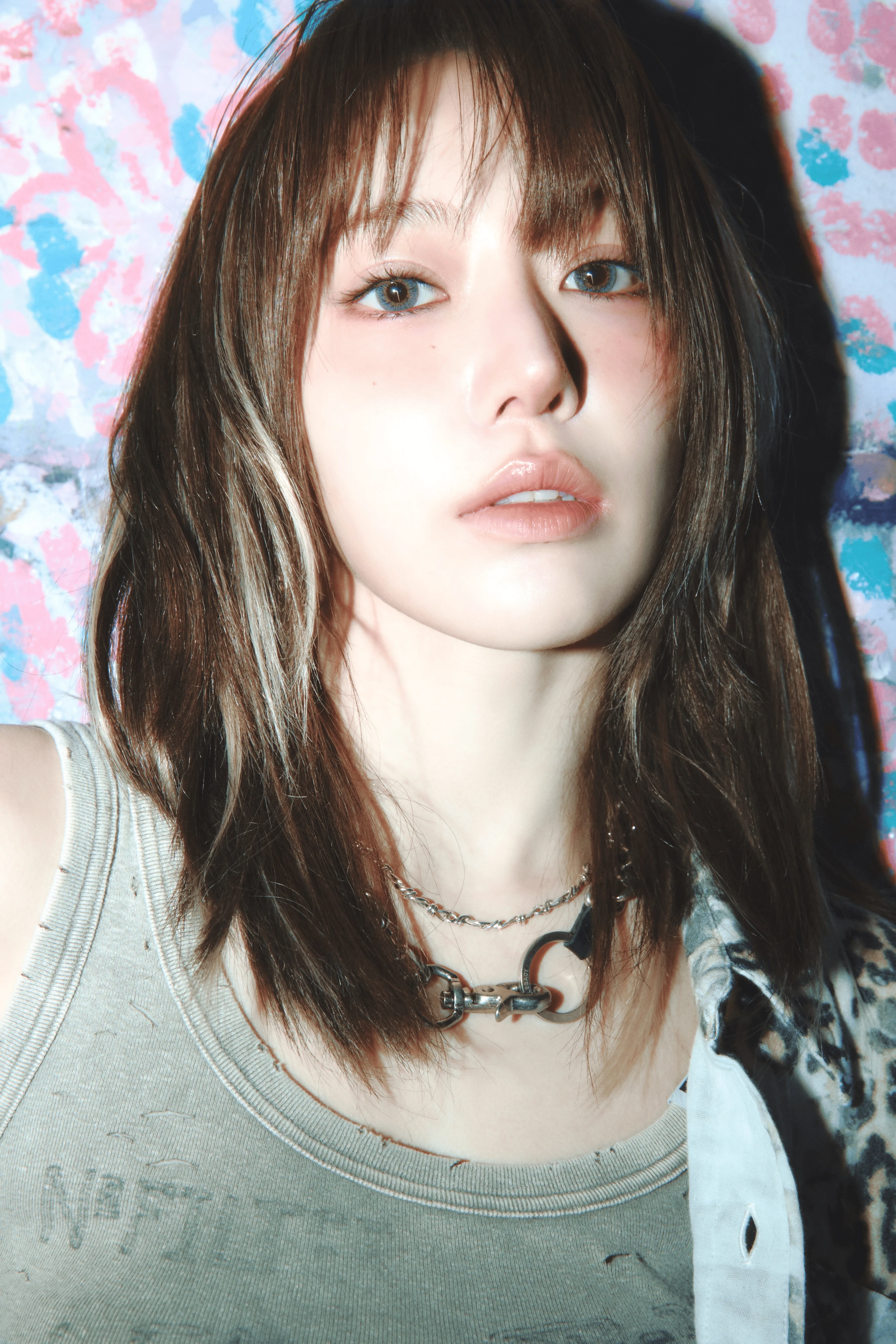 Sakura (LE SSERAFIM) wearing sunshine pastel outfits with fluid fabric and glow, showcasing sherbet peach, sea glass, buttermilk, mint foam, and rose coral from the Light Spring palette.