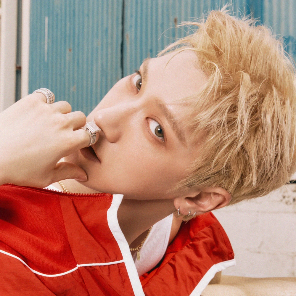 Editorial gallery of Ten (NCT) styled in bold winter ensembles mixing neon pops, inky black, and chrome sparkle, highlighting ultra violet, neon fuchsia, electric jade, polished pewter, and onyx.